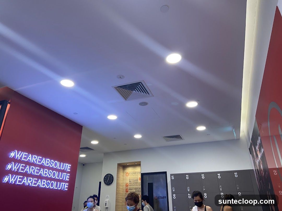 Gym Interior with Lockers and Neon Sign