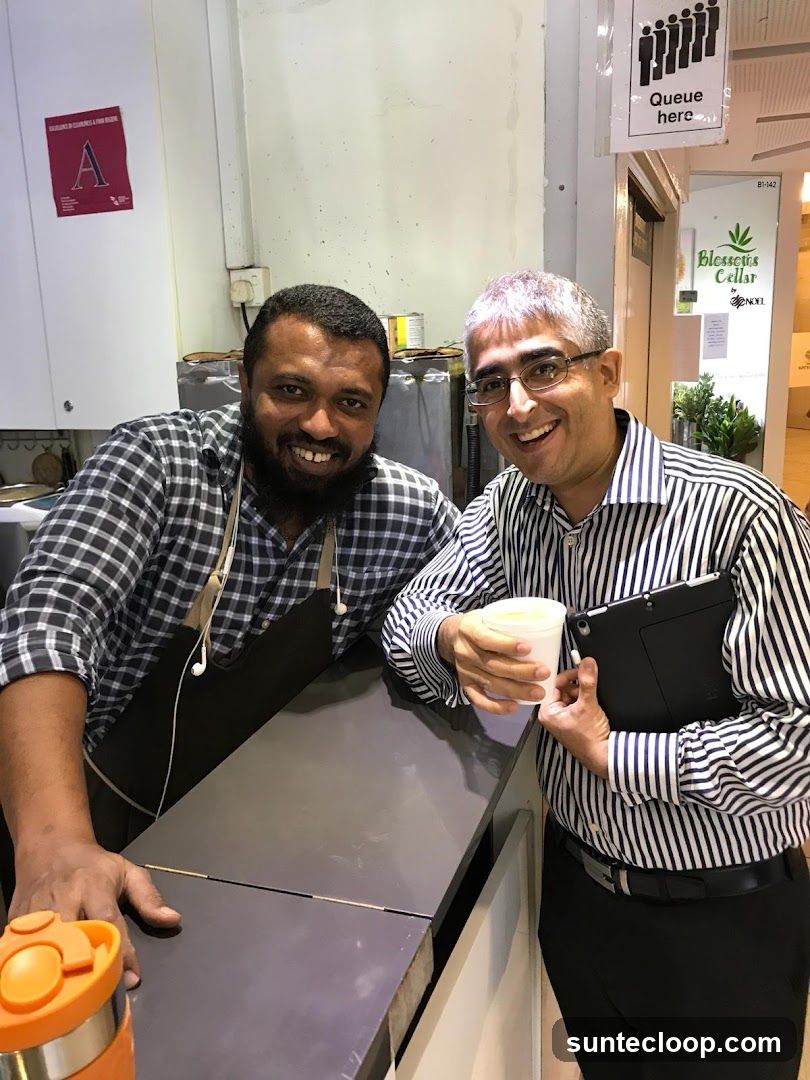 Two Men Smiling at a Counter