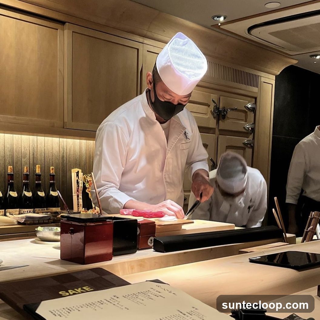 Chefs preparing food at a sushi bar