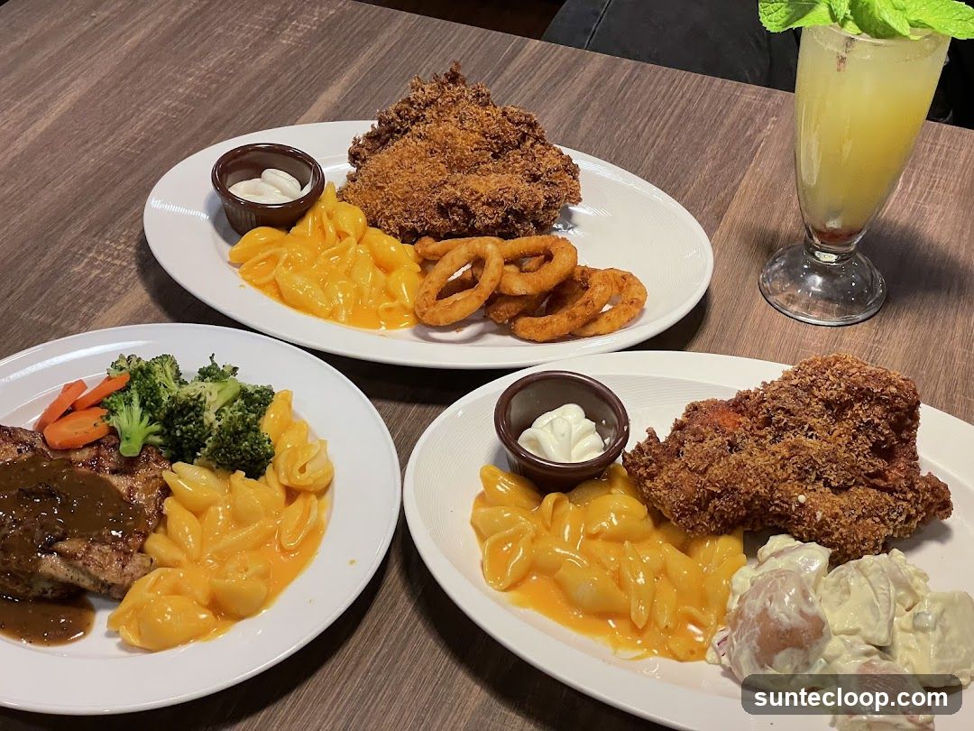 Three Plates of Food and a Drink