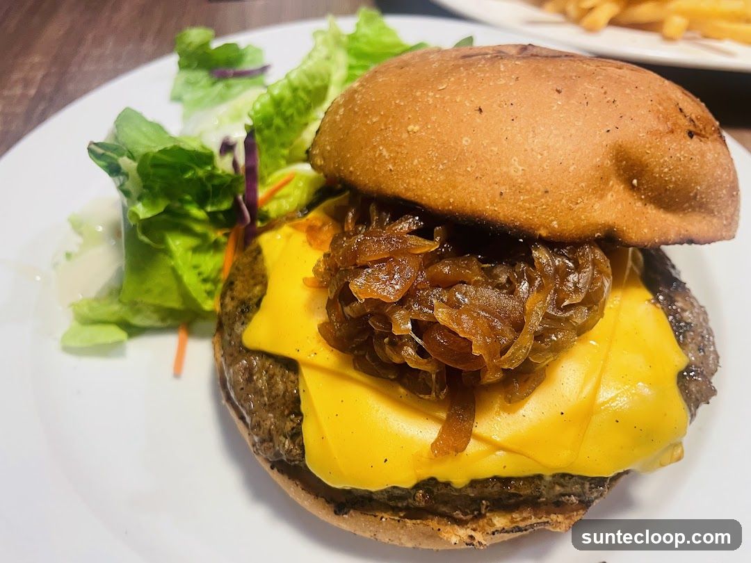 Cheeseburger with Caramelized Onions and Side Salad
