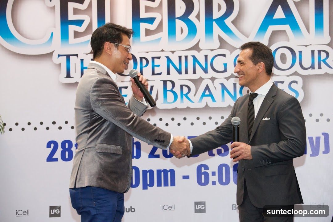 Two men shaking hands at an event
