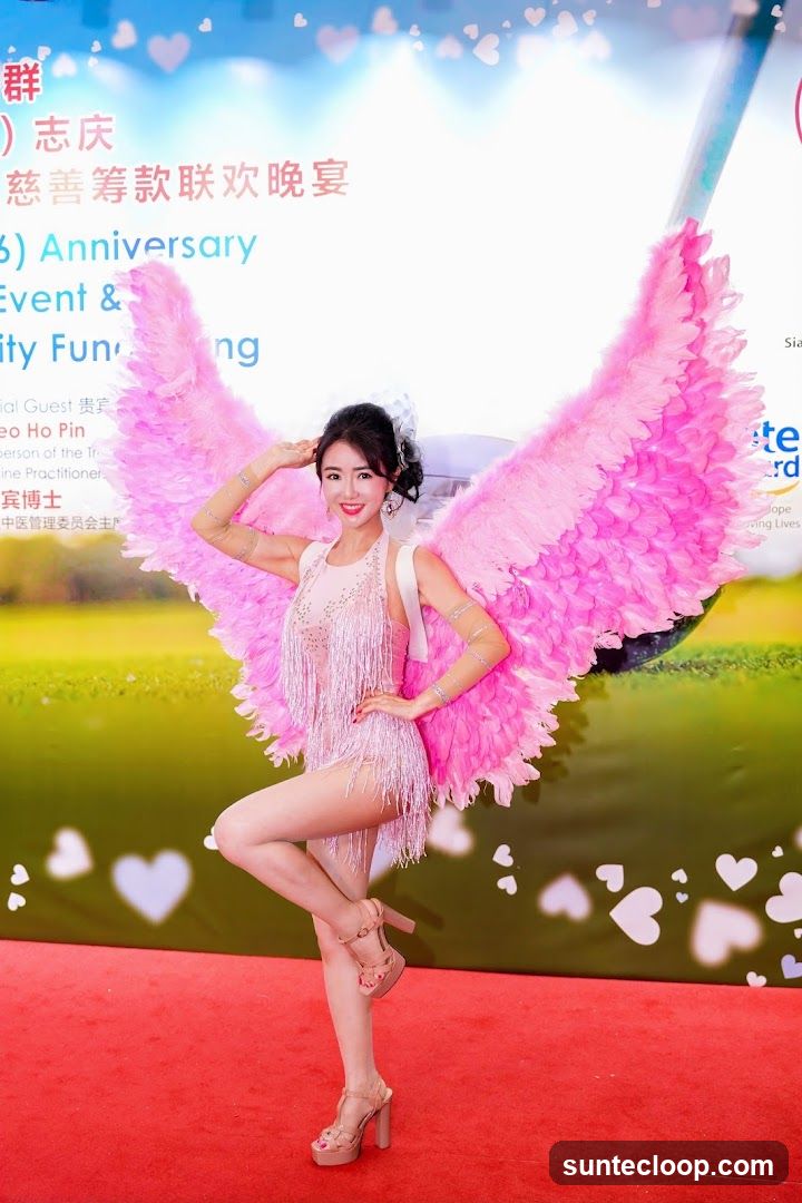 Woman in Angel Costume Posing