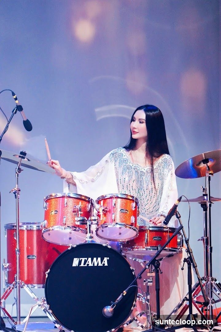 Woman playing drums