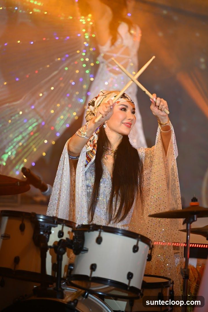Woman playing drums on stage