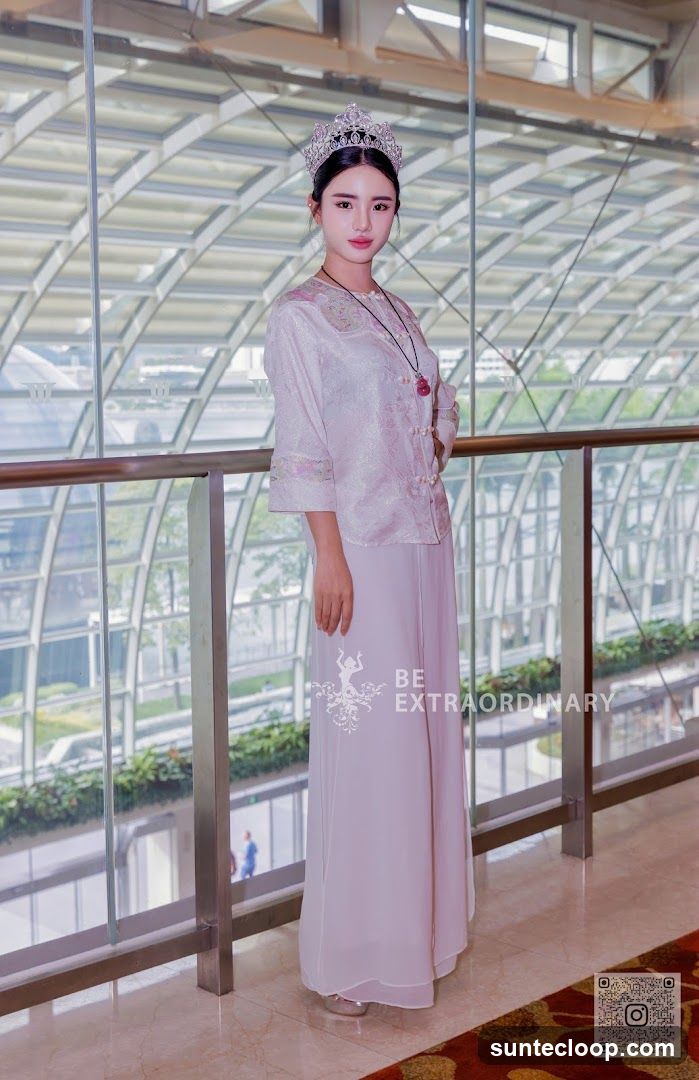 Woman in Traditional Attire with Crown