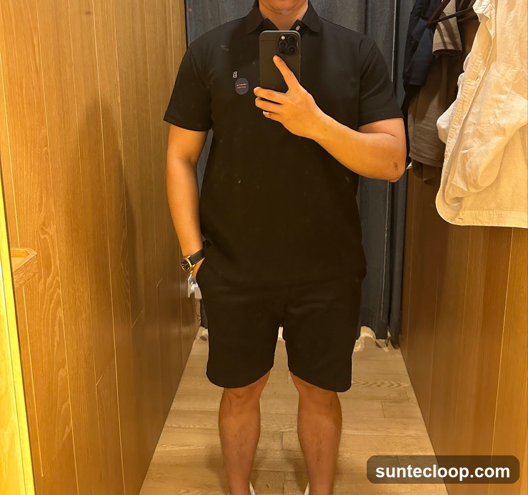 Man in Black Polo and Shorts