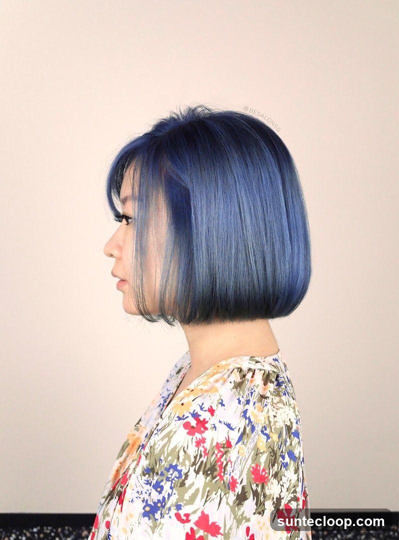 Woman with blue bob haircut