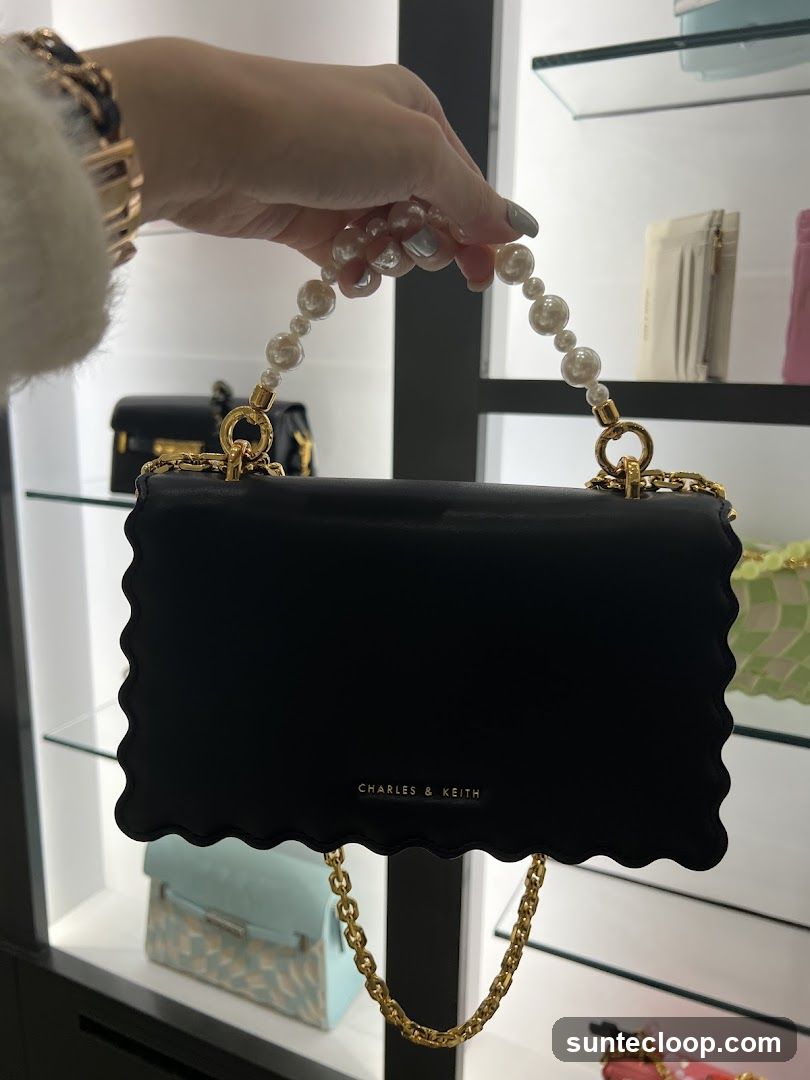 Black handbag with pearl handle