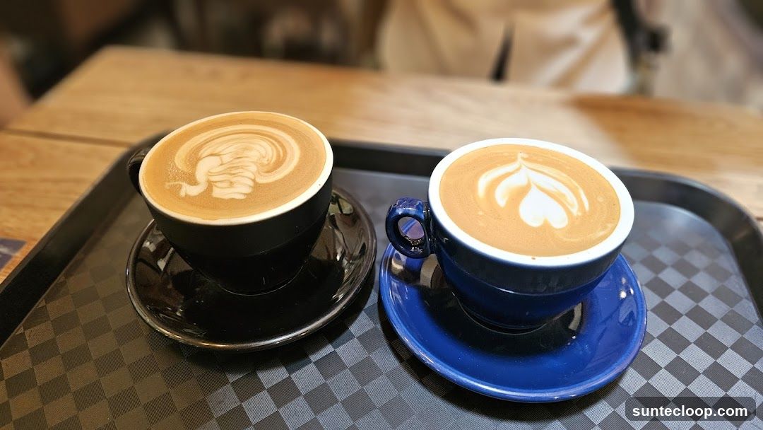 Two coffees with latte art