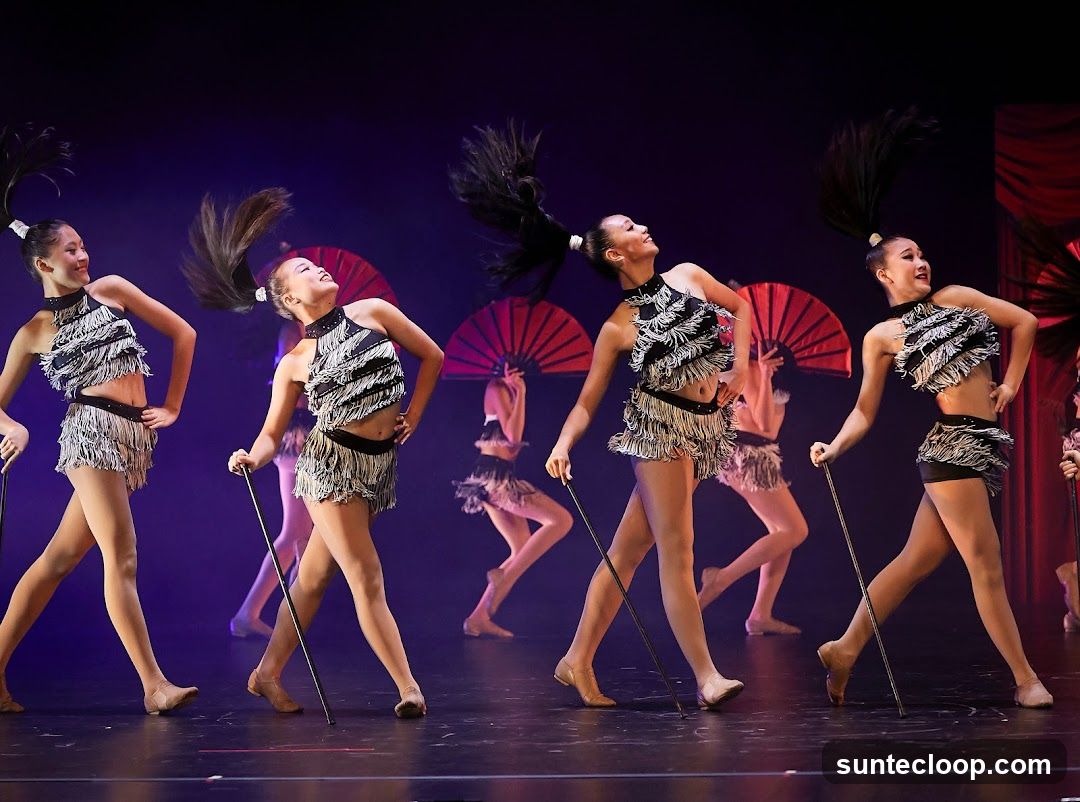 Dancers in Fringed Outfits with Fans