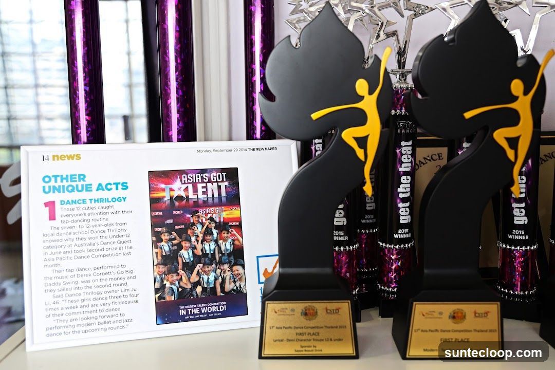Dance Competition Trophies and News Clipping