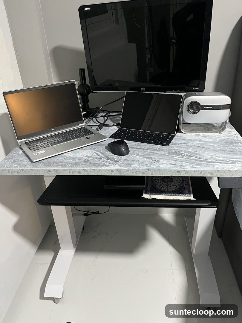 Desk Setup with Laptops and Projector