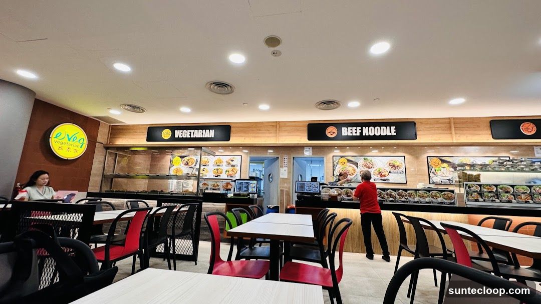 Food court with vegetarian and beef noodle stalls