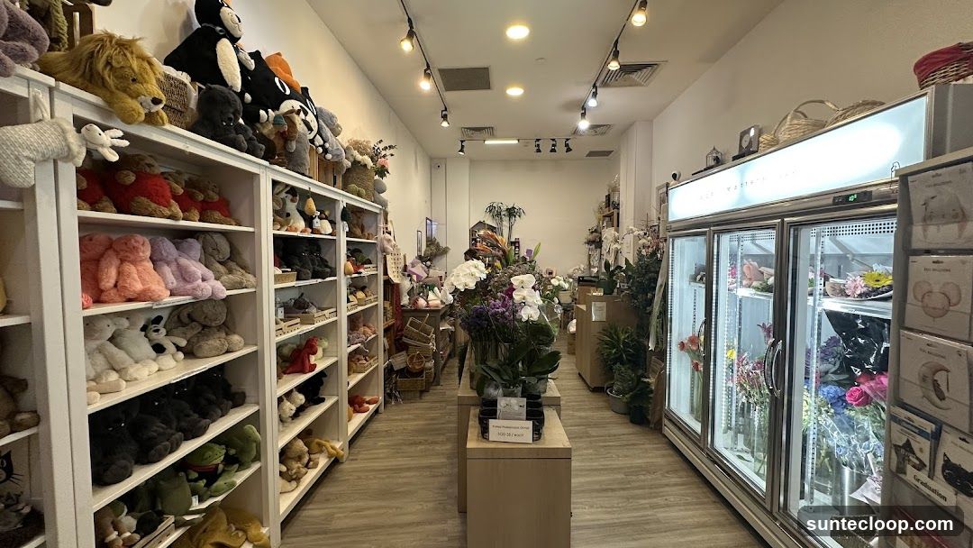 Flower shop interior with plush toys and floral arrangements