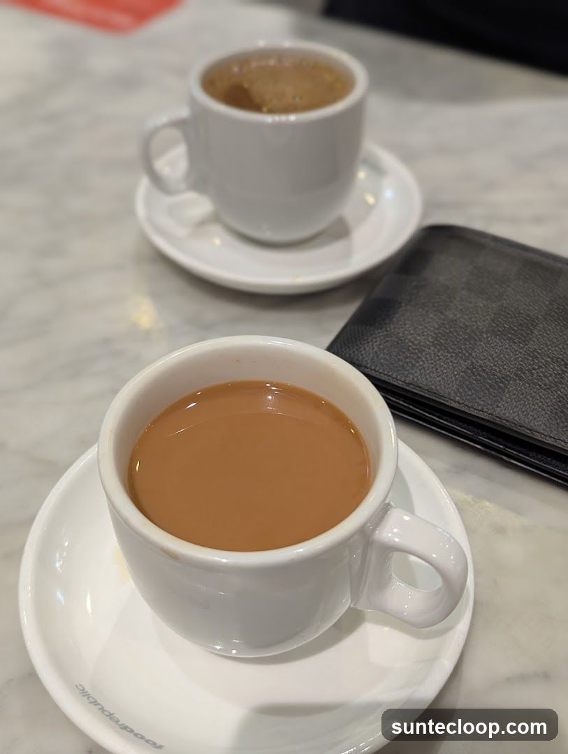 Two cups of coffee on a marble table