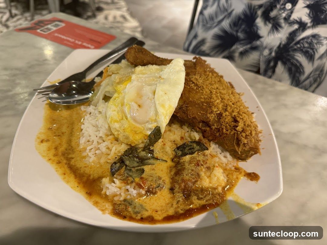 Nasi Lemak with Fried Chicken and Egg