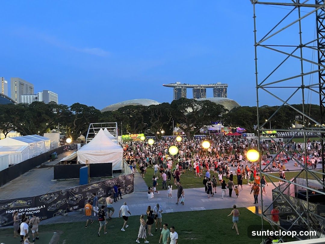 Outdoor Event with Crowd and City Skyline