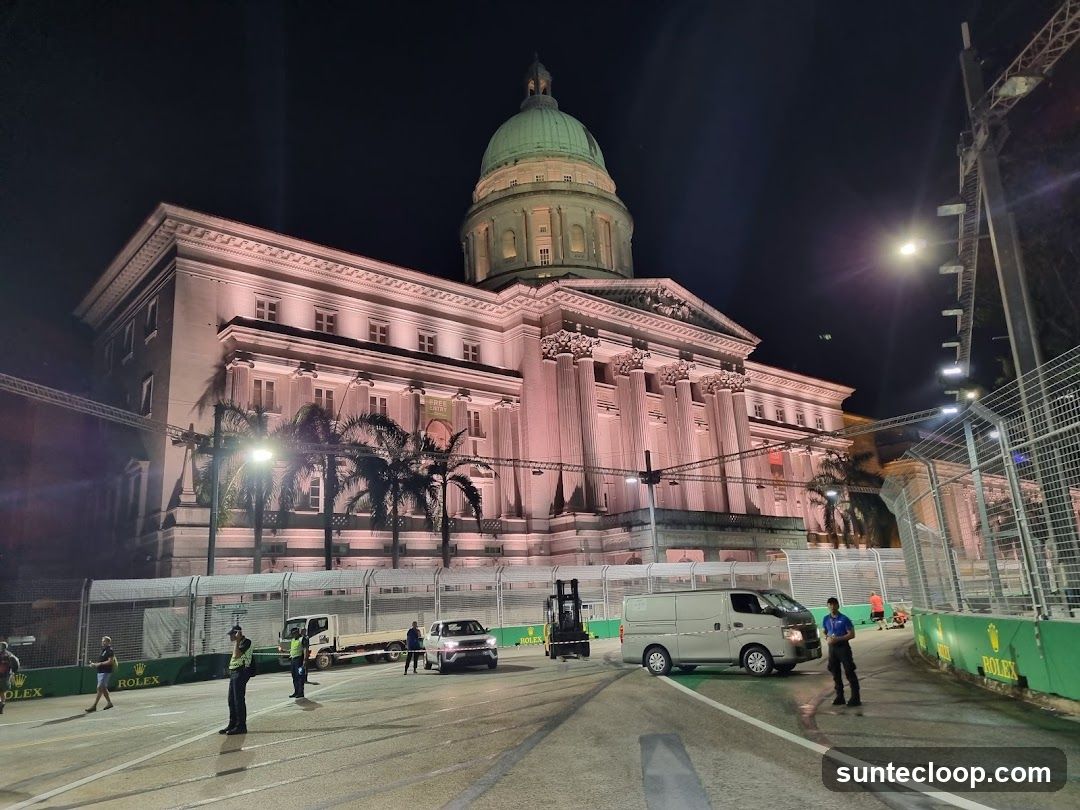 Nighttime View of a Grand Building with a Race Track
