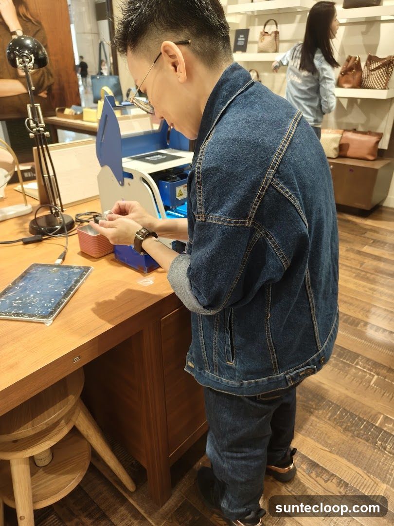 Man operating a machine in a store