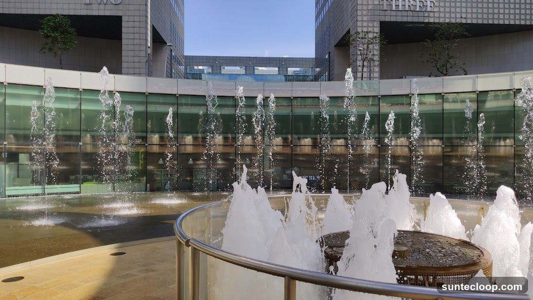 Fountain in front of glass-fronted building