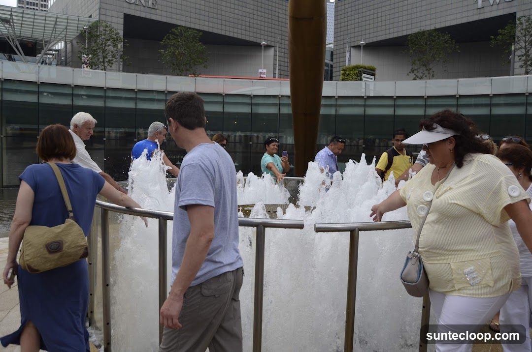 People interacting with a fountain
