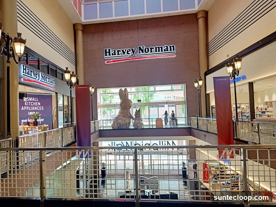 Interior of a shopping mall with Harvey Norman stores