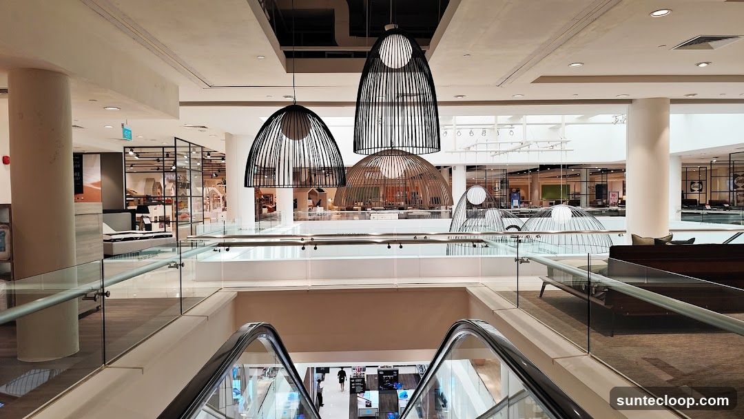 Department Store Interior with Escalators and Decorative Lights