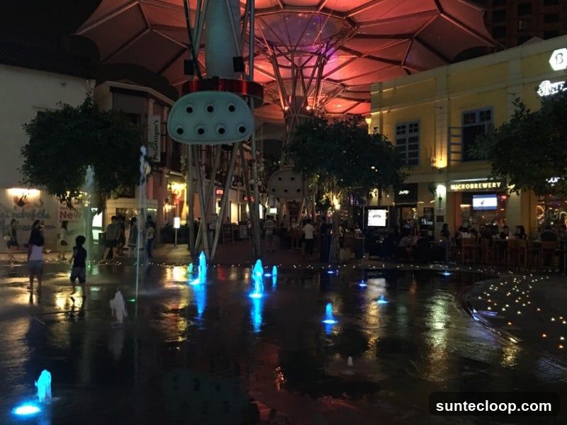 Nighttime Fountain Plaza with Restaurants