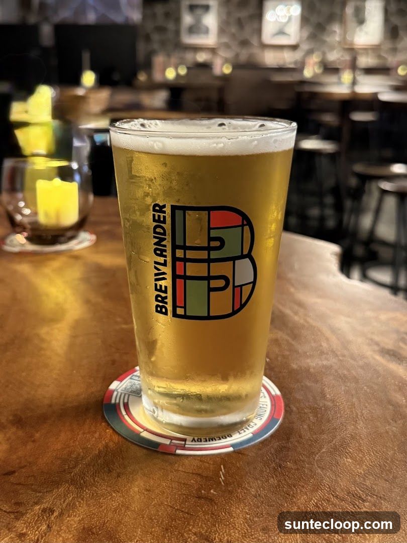 Beer in a glass with brewery logo