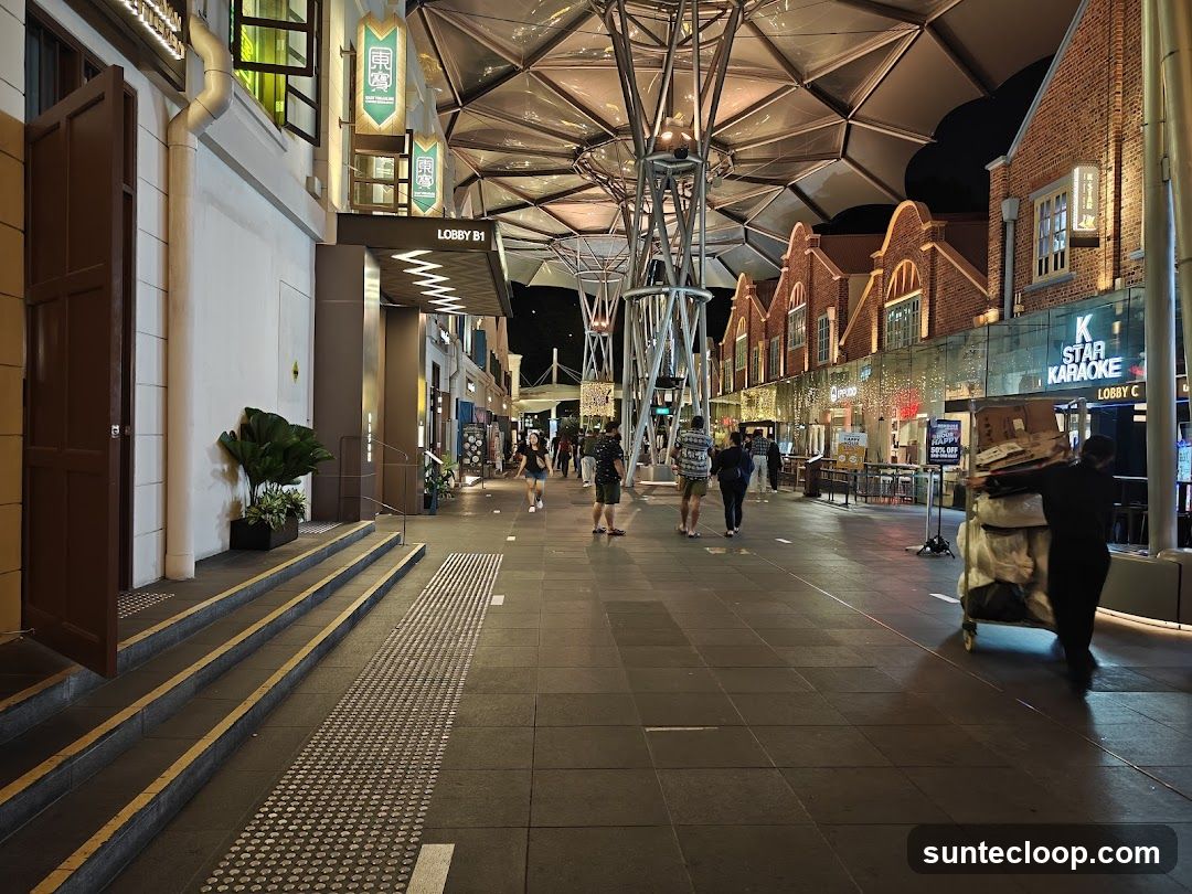 Nighttime street scene with shops and people