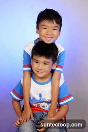 Two boys posing for a photo