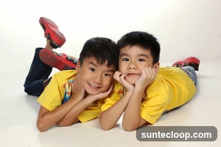 Two boys posing for a photo
