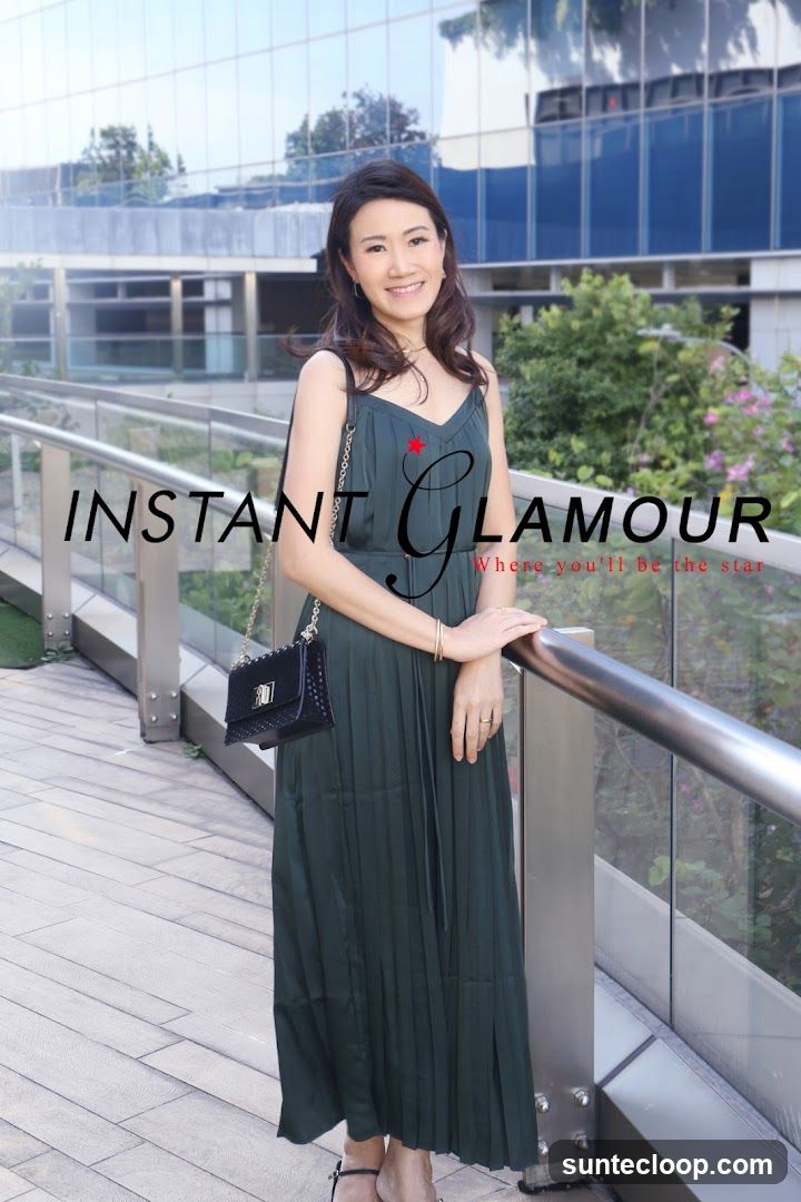 Woman Posing in Front of a Modern Building