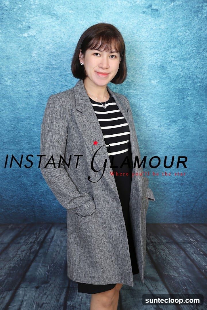 Woman Posing in Front of a Textured Blue Background