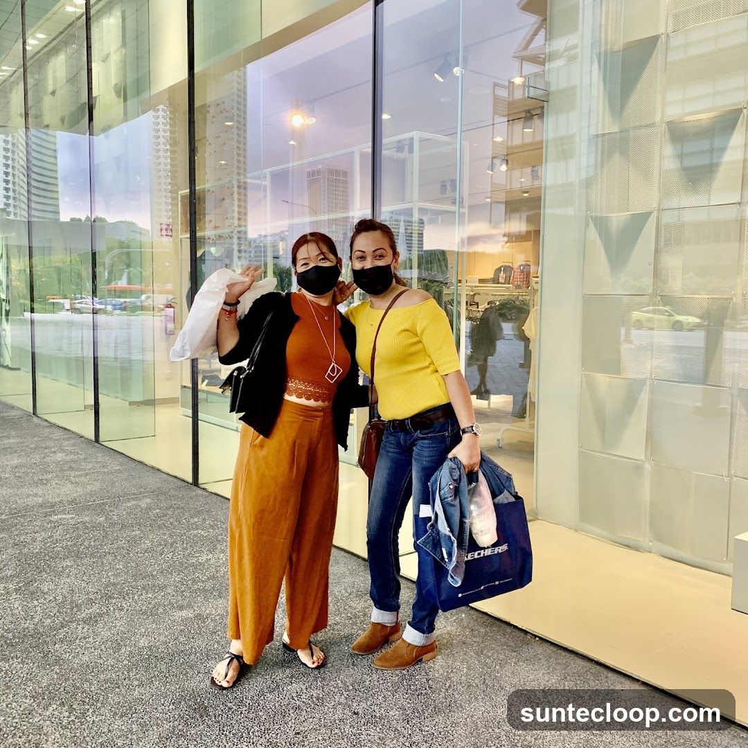 Two Women Posing Outside a Store