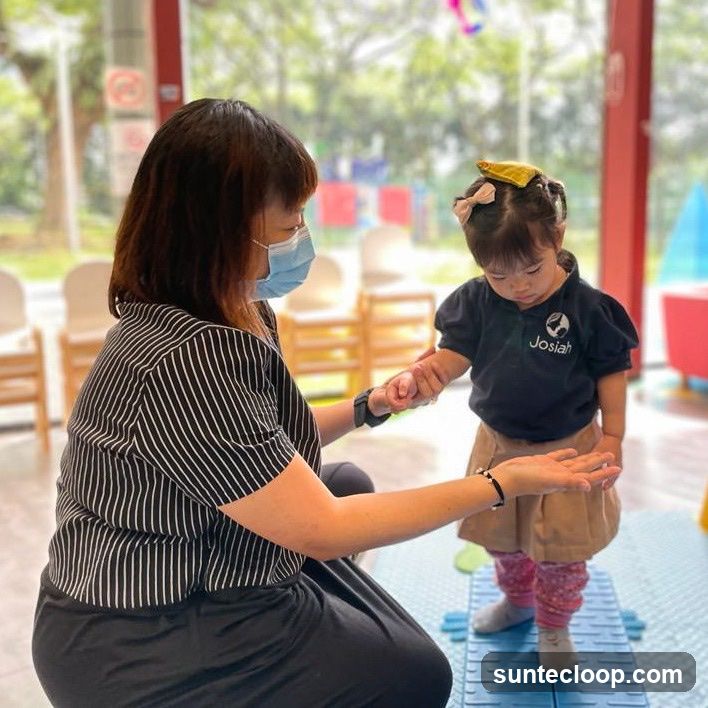 Therapist assisting a child
