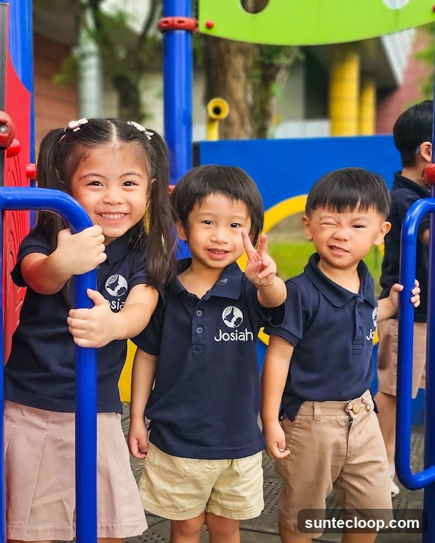 Children in school uniforms on a playground