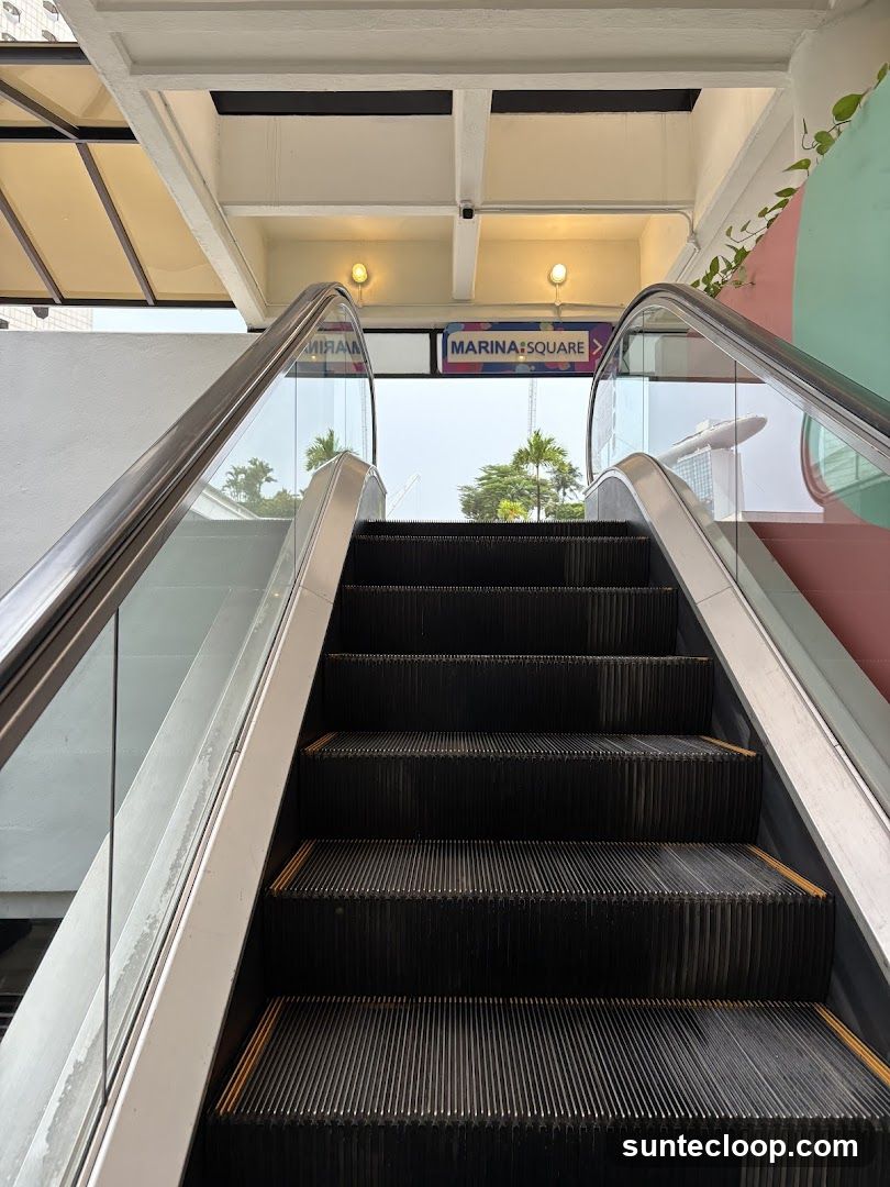 Escalator with Marina Square Sign
