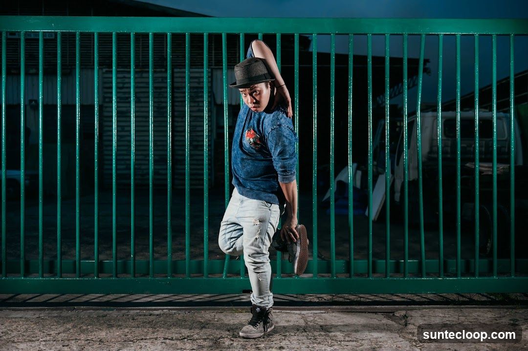 Dancer in front of a green gate
