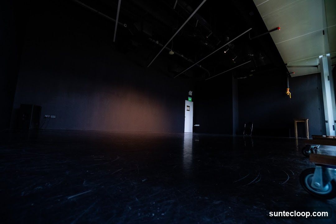 Empty Room with Exit Sign