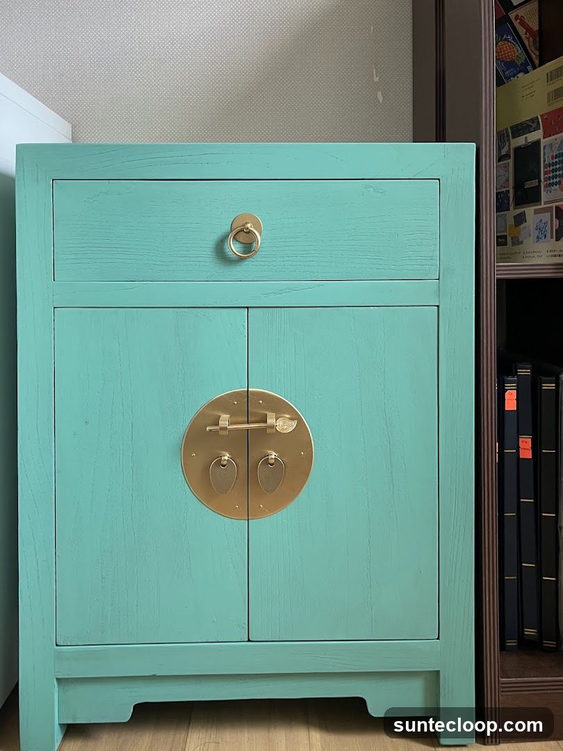 Turquoise Cabinet with Brass Hardware