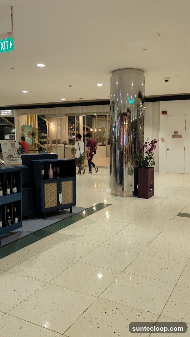 Interior of a shopping mall with a store entrance and display