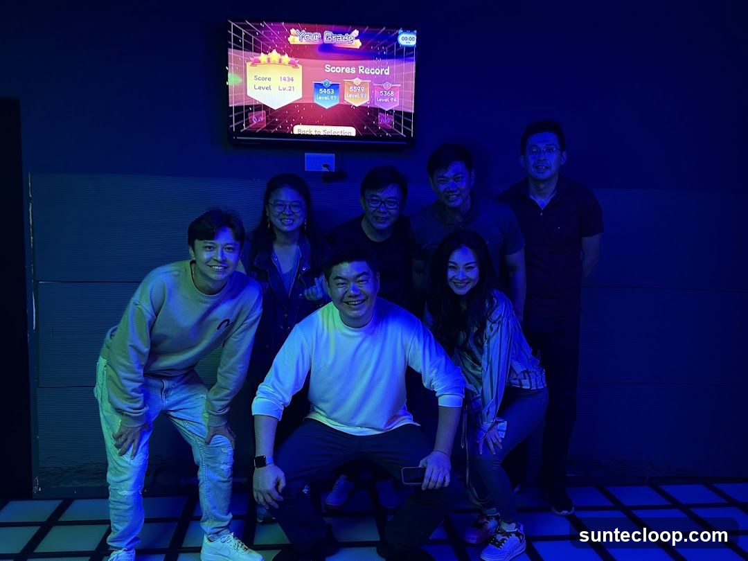 Group Posing in a Room with a Screen