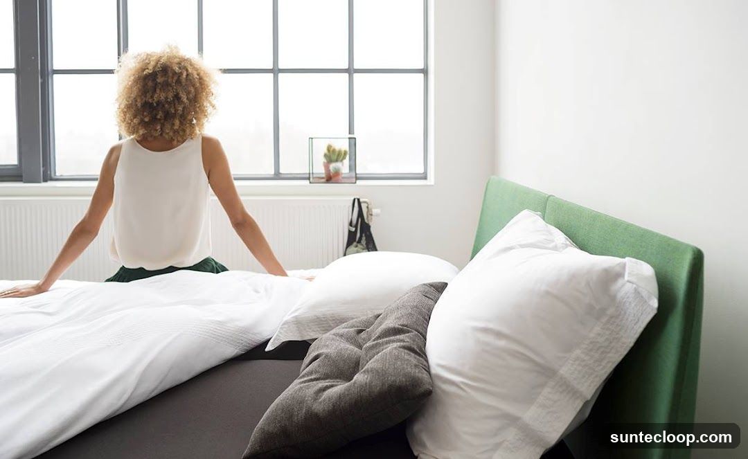 Woman sitting on a bed