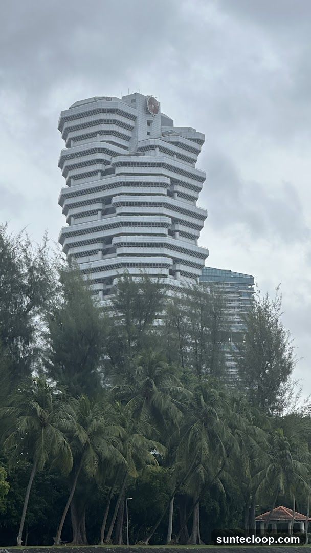 Futuristic Building with Tropical Trees