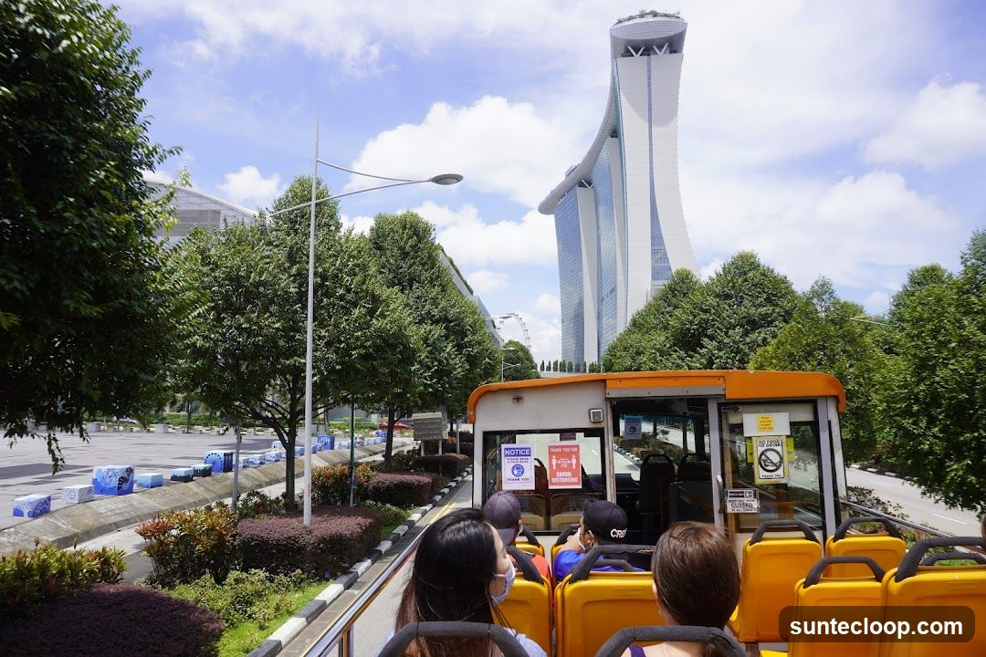 Open-top bus tour with Marina Bay Sands in the background