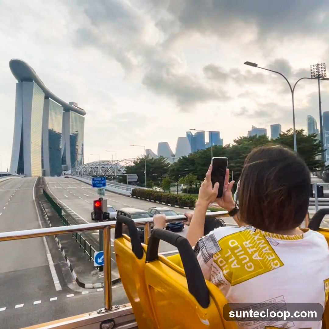 Tourists on a bus viewing Marina Bay Sands