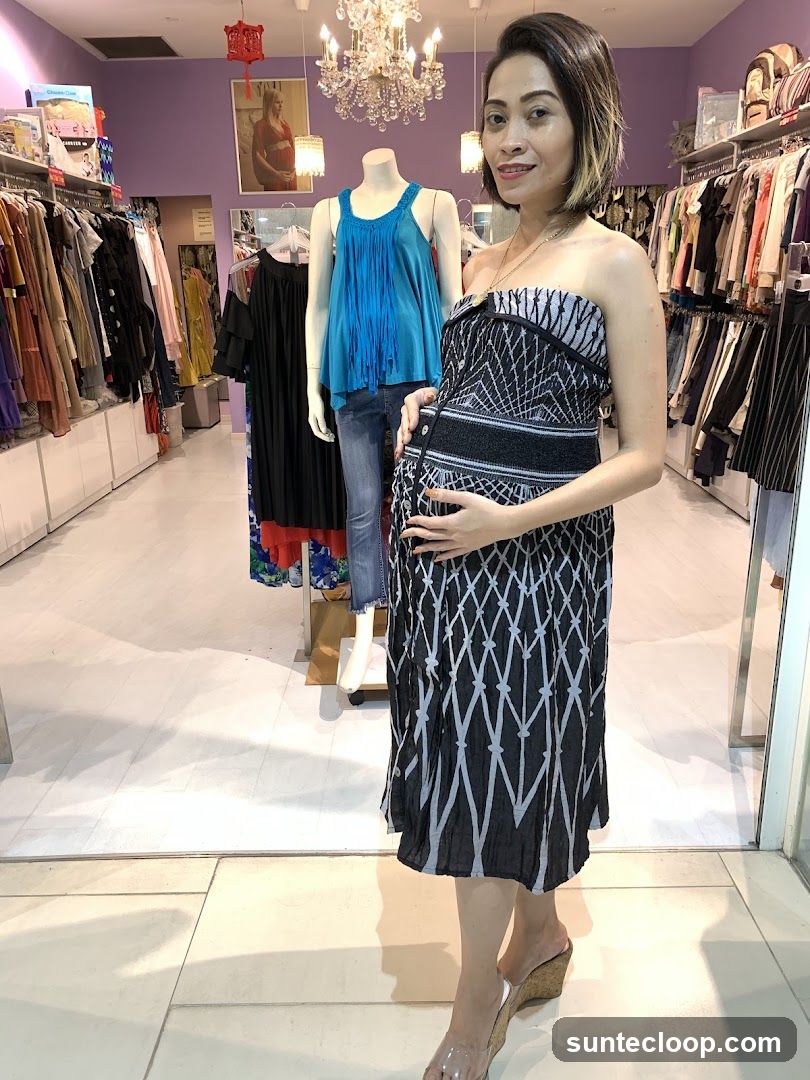 Woman in a patterned dress in a clothing store