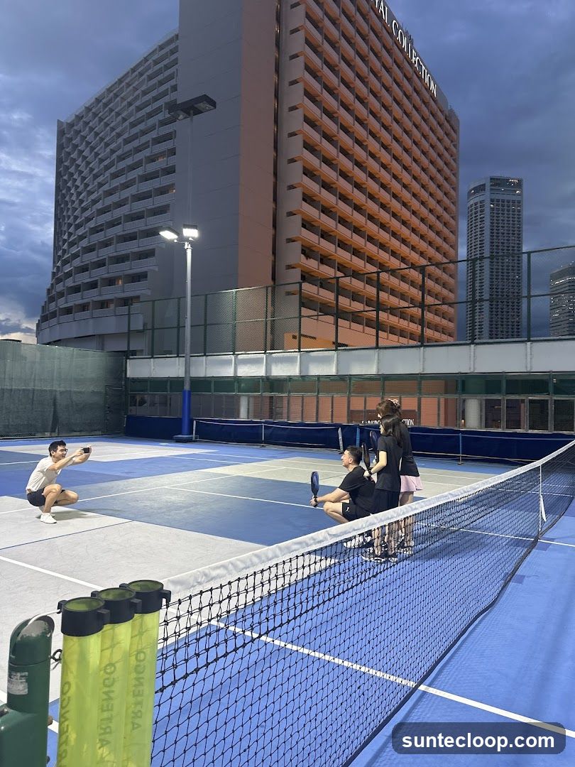 People playing pickleball on a rooftop court